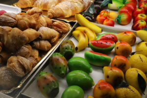 Produce from Delizie dolci e salate, sweets and specialities at Mercato Albinelli in Modena
