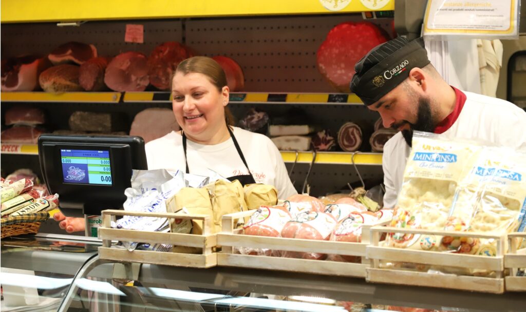 The Salumeria da Sergio counter display at Mercato Albinelli in Modena