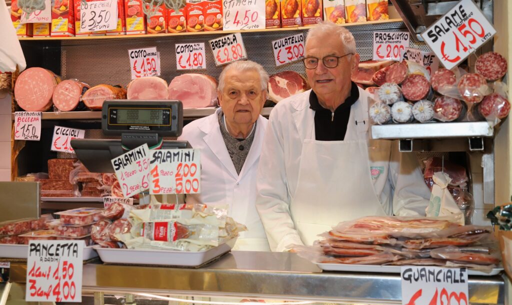 The Salumeria Anselmo Bonini, Andrea Solieri, A. Facchini stall at Mercato Albinelli in Modena